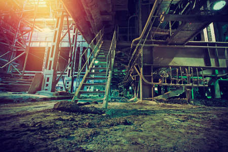 Old creepy, dark, decaying, destructive, dirty factoryの写真素材