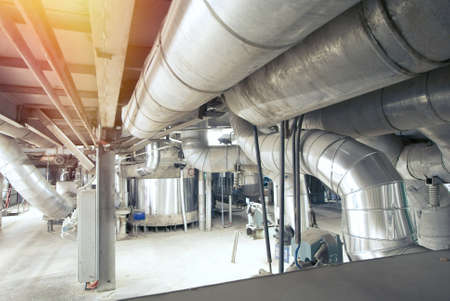 Equipment, cables and piping as found inside of a modern industrial power plant
