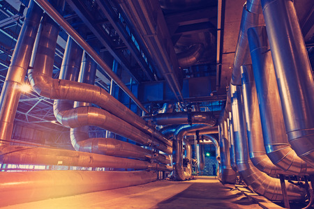 Equipment, cables and piping as found inside of a modern industrial power plantの写真素材