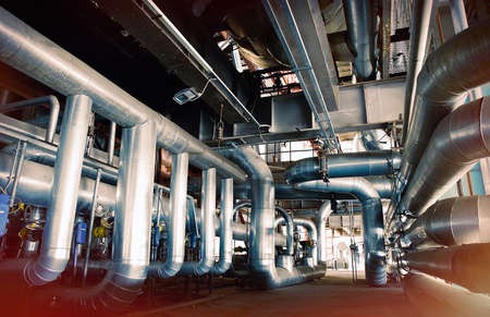 Equipment, cables and piping as found inside of a modern industrial power plant