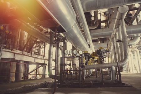Equipment, cables and piping as found inside of a modern industrial power plantの写真素材