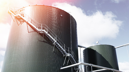 Industrial zone, Steel pipelines and tanks against blue skyのeditorial素材