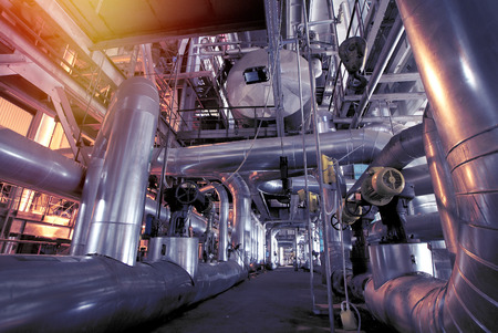 Equipment, cables and piping as found inside of a modern industrial power plant