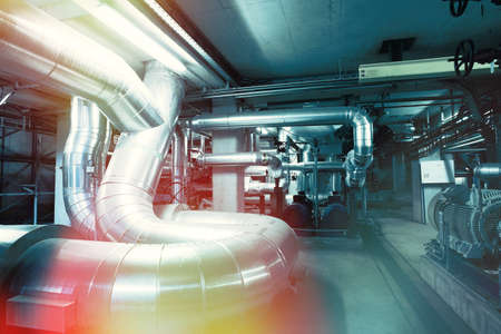 Equipment, cables and piping as found inside of a modern industrial power plant      