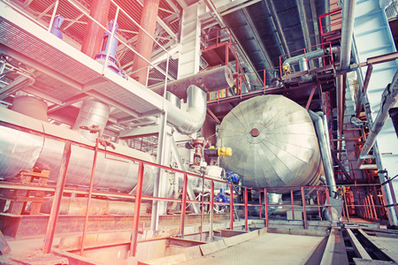 Equipment, cables and piping as found inside of a modern industrial power plant  