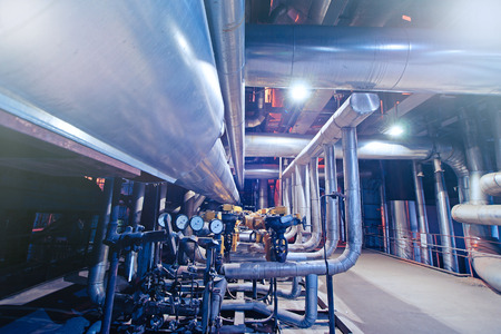 Equipment, cables and piping as found inside of a modern industrial power plant