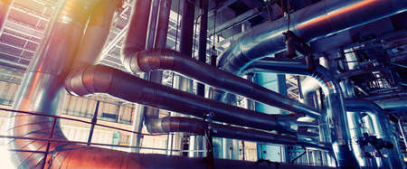 Equipment, cables and piping as found inside of a industrial power plant