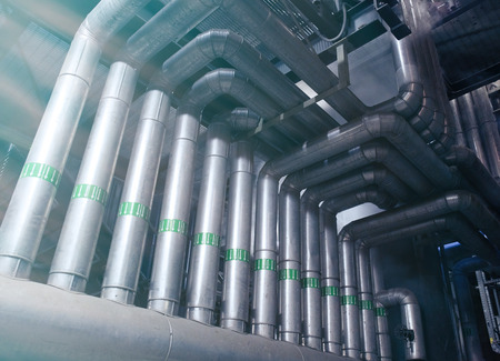 Equipment, cables and piping as found inside of a modern industrial power plant           