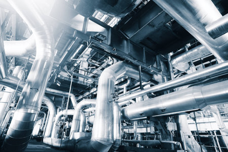 Equipment, cables and piping as found inside of a modern industrial power plant