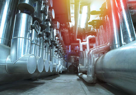 Equipment, cables and piping as found inside of  industrial power plantの写真素材