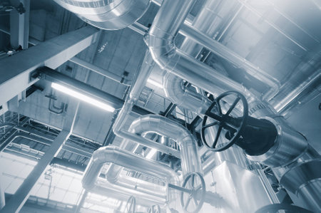 Equipment, cables and piping as found inside of a industrial power plantの写真素材