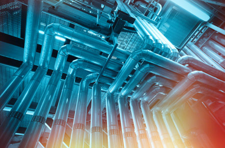 Equipment, cables and piping as found inside of a industrial power plantの写真素材