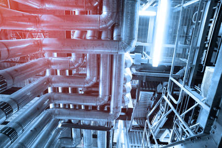 Equipment, cables and piping as found inside of a industrial power plant