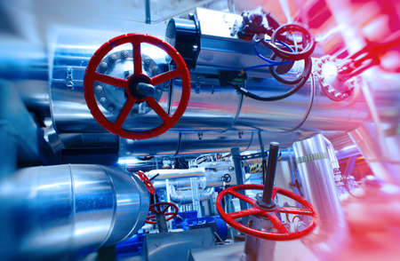 Industrial Factory. Various mechanisms and metal pipes. Toned image. Motion blur effect.