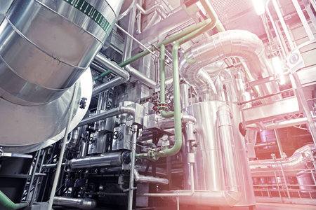 Equipment, cables and piping as found inside of a modern industrial power plant          
