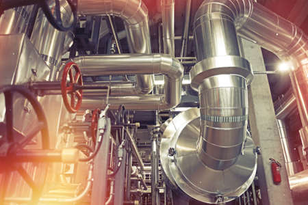 Equipment, cables and piping as found inside of a modern industrial power plant       の写真素材