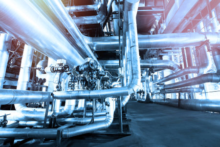 Equipment, cables and piping as found inside of a modern industrial power plant