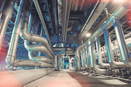 Equipment, cables and piping as found inside of a modern industrial power plantの写真素材