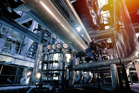 Equipment, cables and piping as found inside of a modern industrial power plantの写真素材