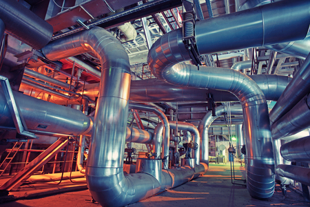 Equipment, cables and piping as found inside of a modern industrial power plantの写真素材