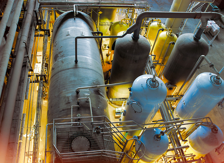 Equipment, cables and piping as found inside of a modern industrial power plant