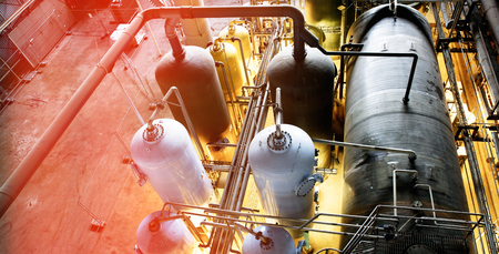 Equipment, cables and piping as found inside of a modern industrial power plant. Industrial zone,...