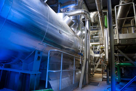 Equipment, cables and piping as found inside of modern industrial power plant