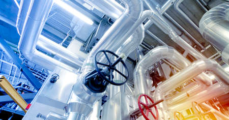 Equipment, cables and piping as found inside of a modern industrial power plant