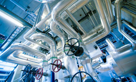 Equipment, cables and piping as found inside of a modern industrial power plant