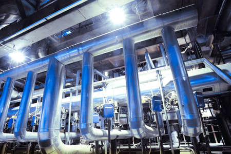 Equipment, cables and piping as found inside of a industrial power plant