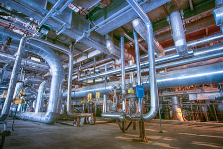 Equipment, cables and piping as found inside of a industrial power plant