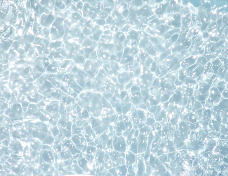 Blue water texture with ripple useful as a background - blue  toneの写真素材