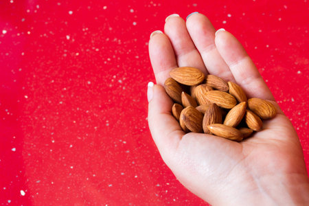 a few almonds macro in a handの写真素材