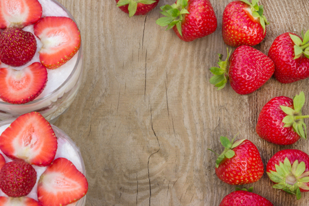 Dessert with cream and fresh strawberries (can be used as background, card)の写真素材