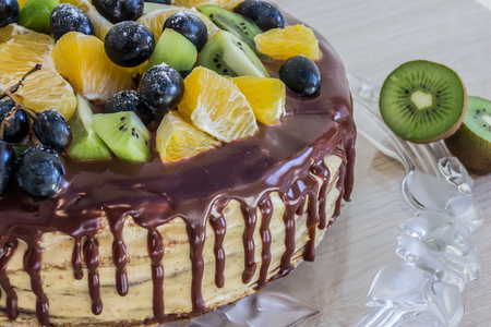 half cake with chocolate and friutsの写真素材