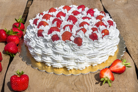 Light, delicate and tasty cream cake with fresh strawberriesの写真素材