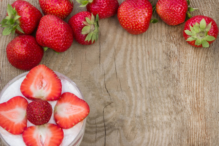 Dessert with cream and fresh strawberriesの写真素材