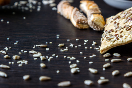 Puff pastries with sunflower seeds, sesame seeds and flax. Small depth of focusの写真素材