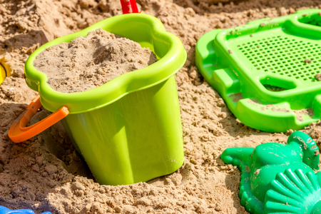 pail, sieve and molds in the sand in the sandbox, children playgroundの写真素材