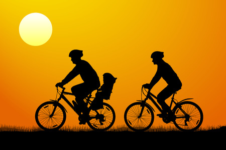 Young couple with child on mountain bikes at sunset, vector silhouetteのイラスト素材