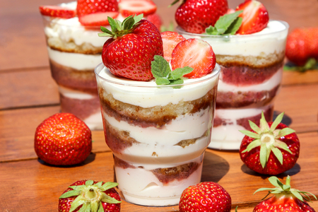 sponge cake decorated strawberries and mintの写真素材