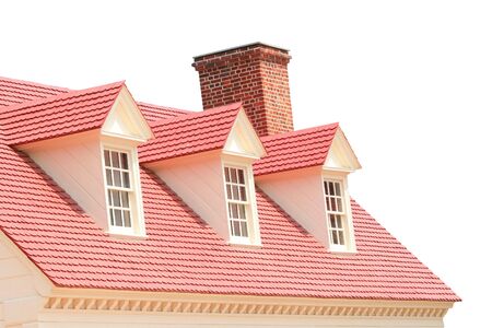 Red Roof of a brick house isolated over whiteの写真素材