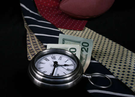 Clock, money, ties, foot ball ball, dollar bills - still life representing gender/male related conceptsの写真素材
