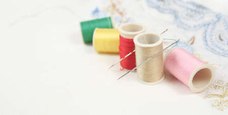Embroidery, sewing background suitable for a banner or a header or a page-width design