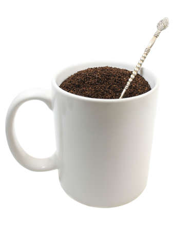 Cup of ground coffee isolated over white, offers space for text and designer imagesの写真素材