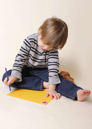 Child drawing with crayon, arts and craftsの写真素材