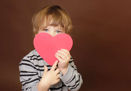 Child holding  Valentine's Day  Heart Signの写真素材