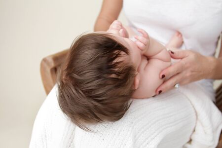 Newborn baby and mother, mom holding baby