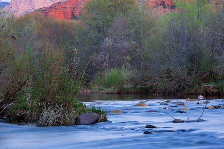 View of red rocks and river at the foot hills of the famous Castle Rock in Sedona, Arizona, AZ, an American landmarkの写真素材