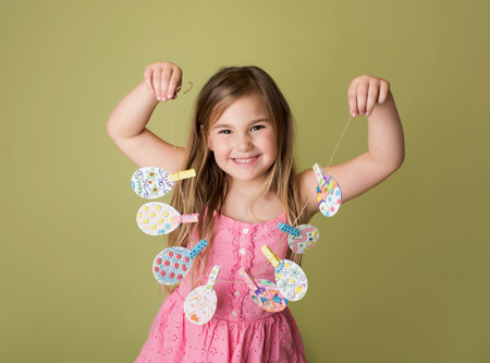 Child with Easter activities and crafts with bunny stickers, Easter Egg shapes in a banner